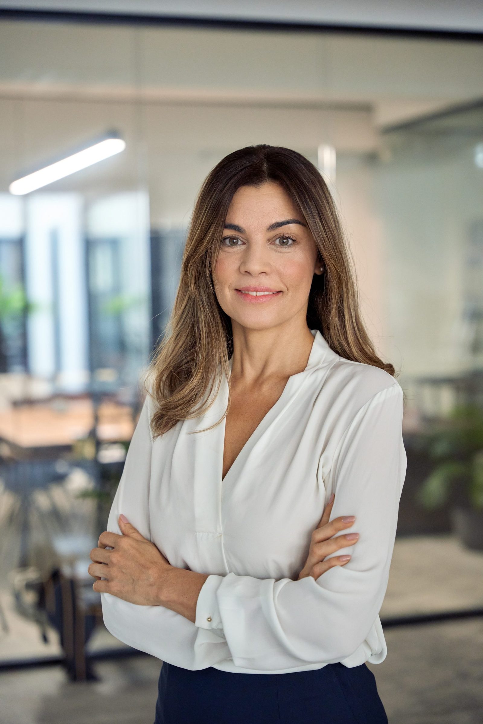 Smiling confident mature business woman in an office