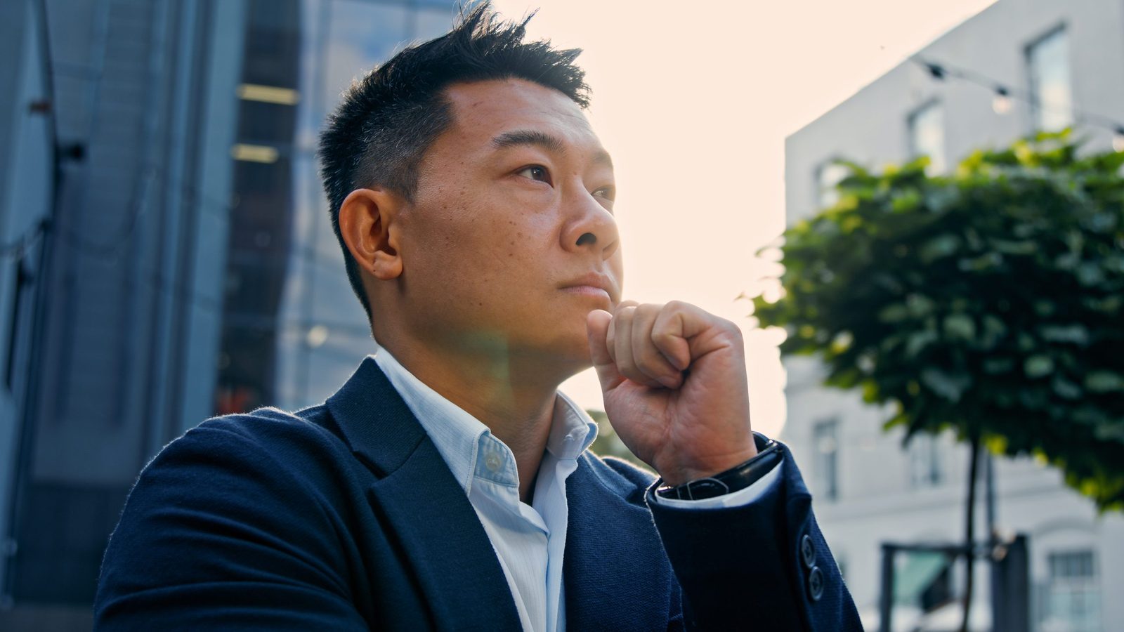 Pensive man thinking at his desk