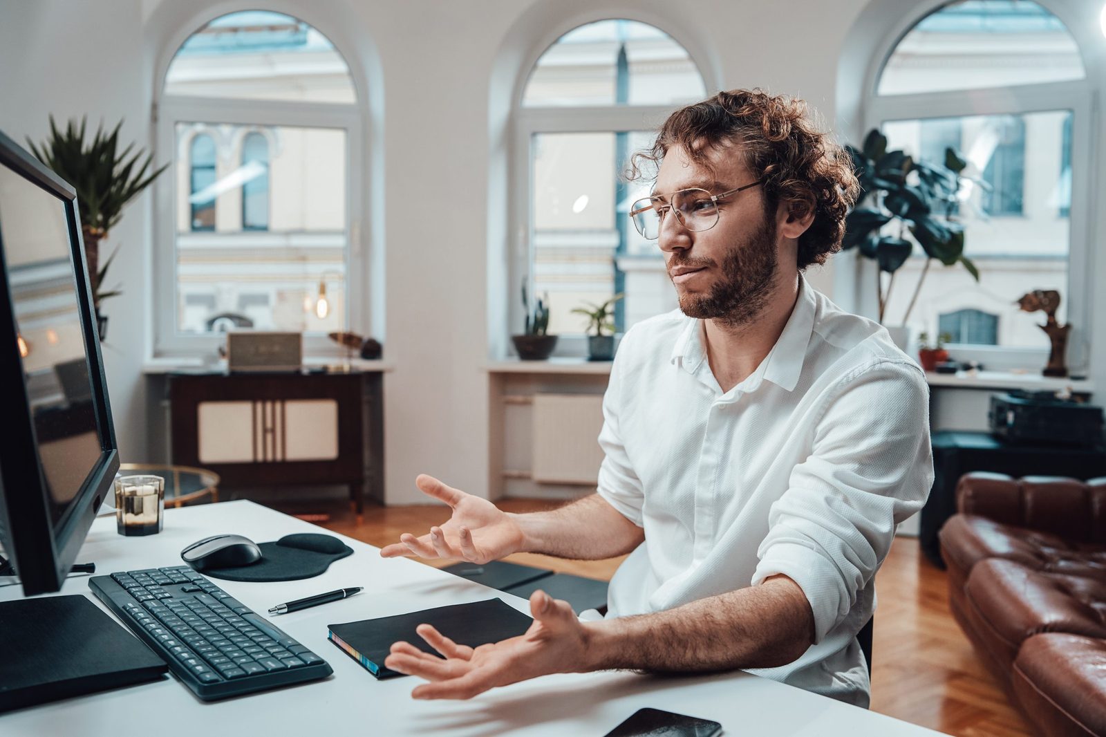 Frustrated man looking at a computer screen
